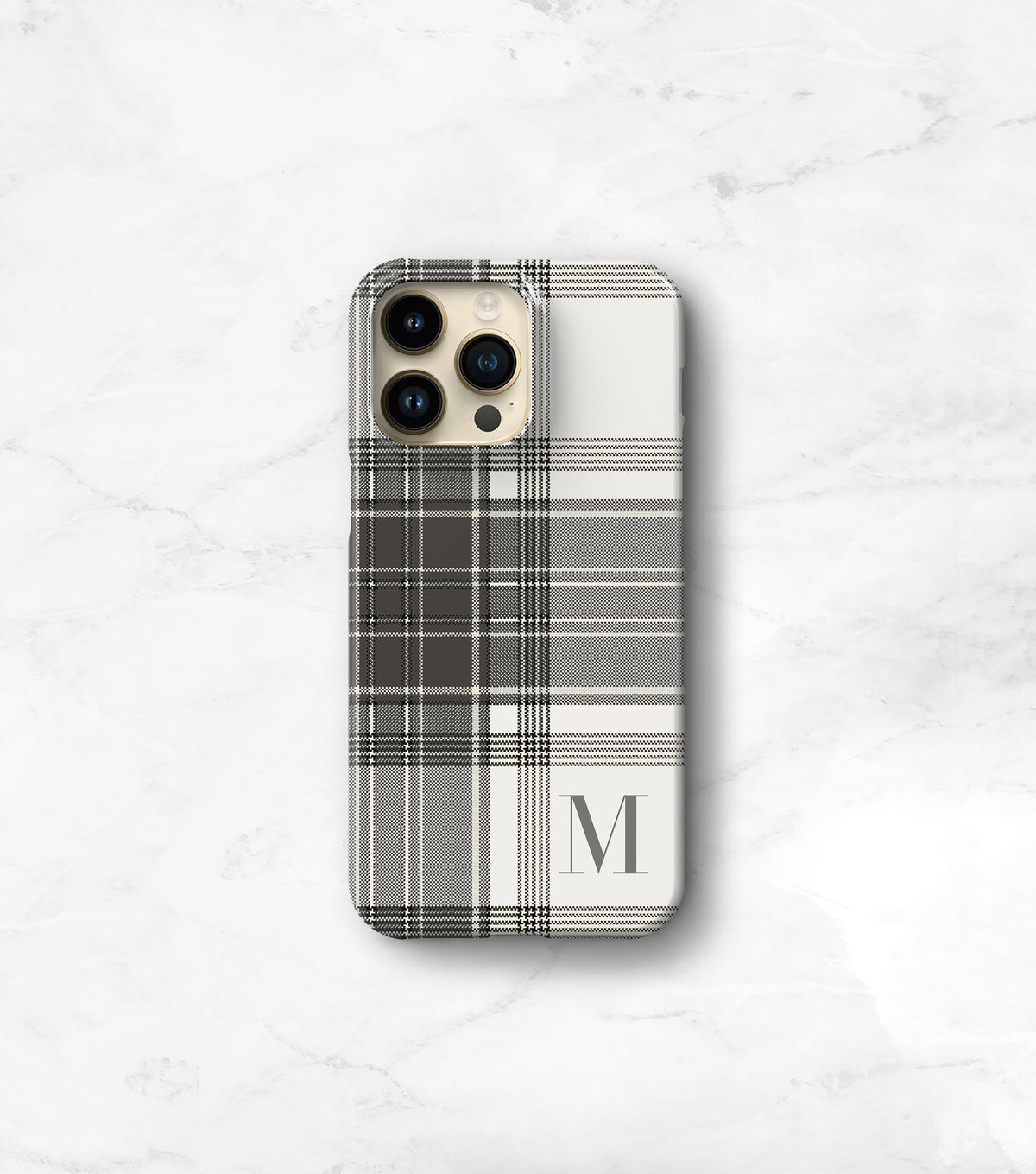 a phone case with a plaid pattern and a monogrammed letter &quot;M&quot; on it.