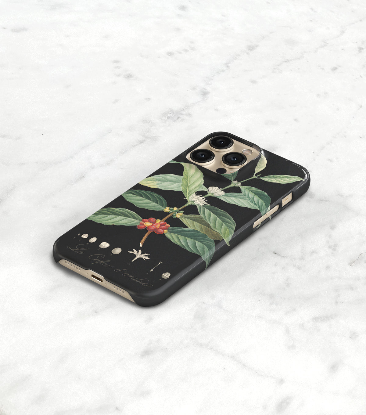 a black phone case with a floral design on it, placed on a white surface.