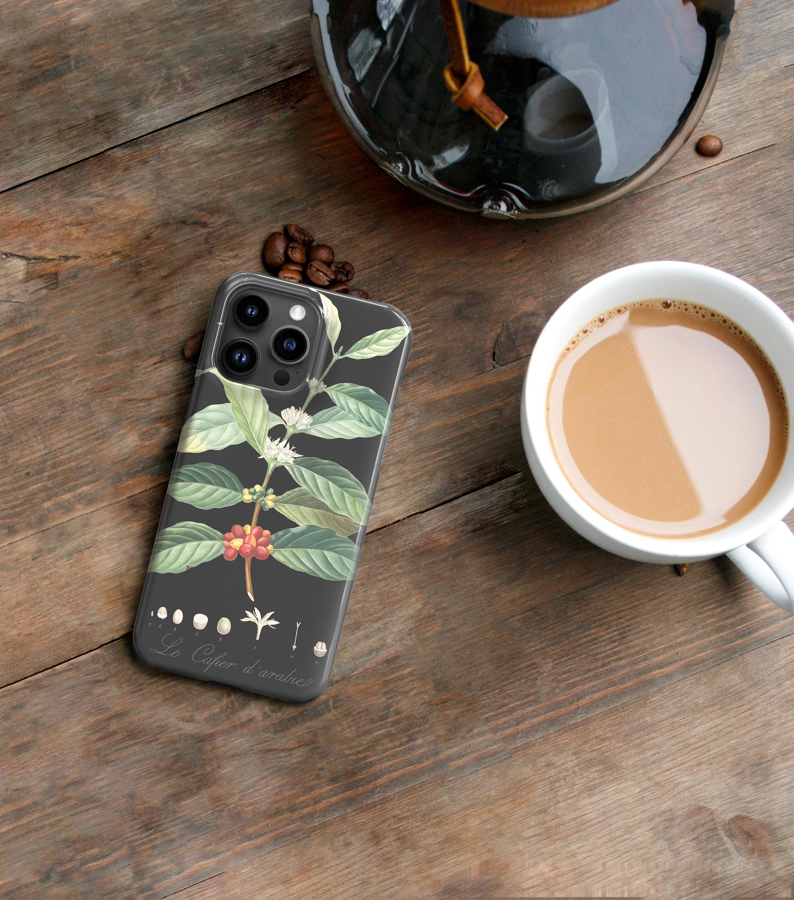a phone case with a plant design, including a coffee bean and leaves, printed on it.