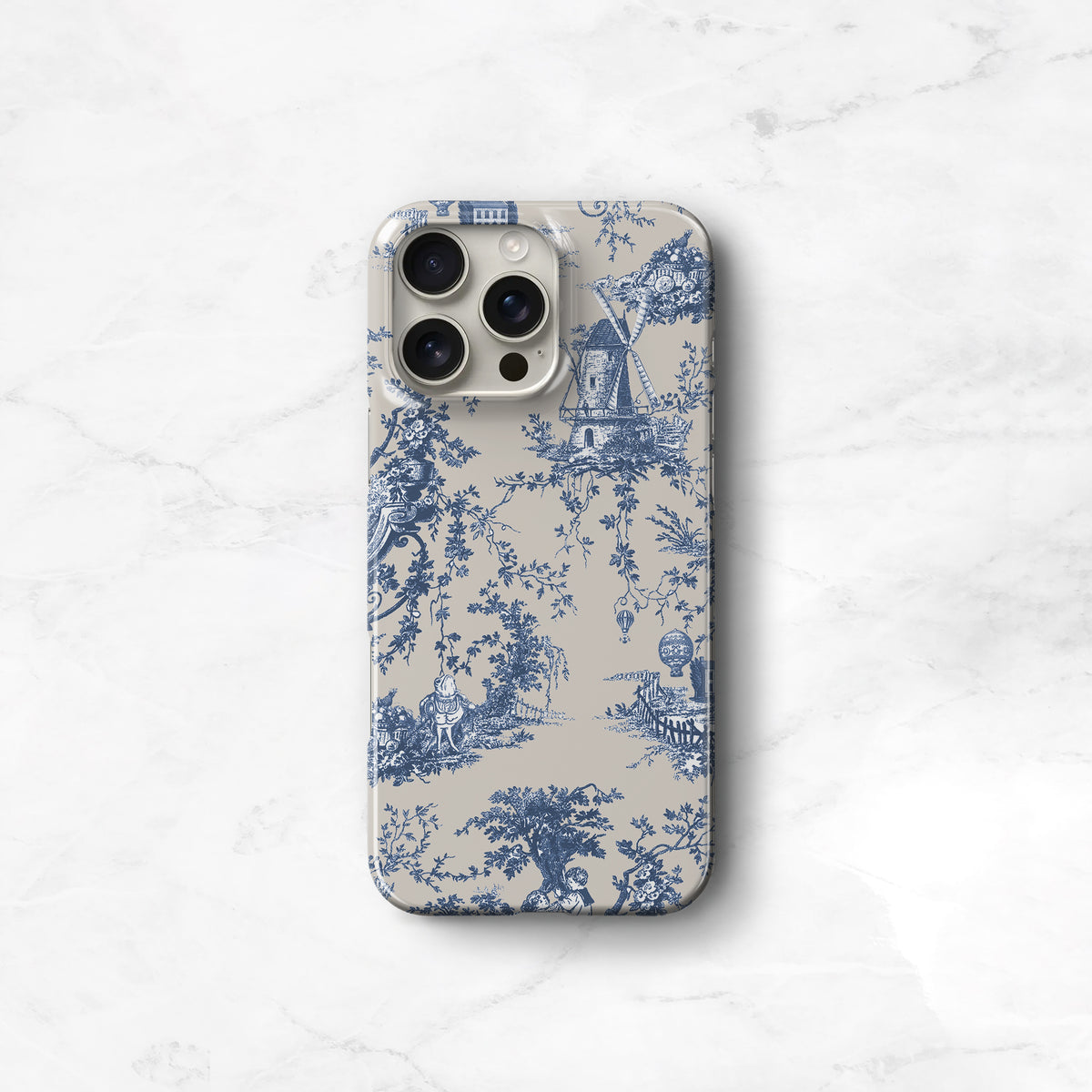 a blue and white phone case sitting on top of a marble surface