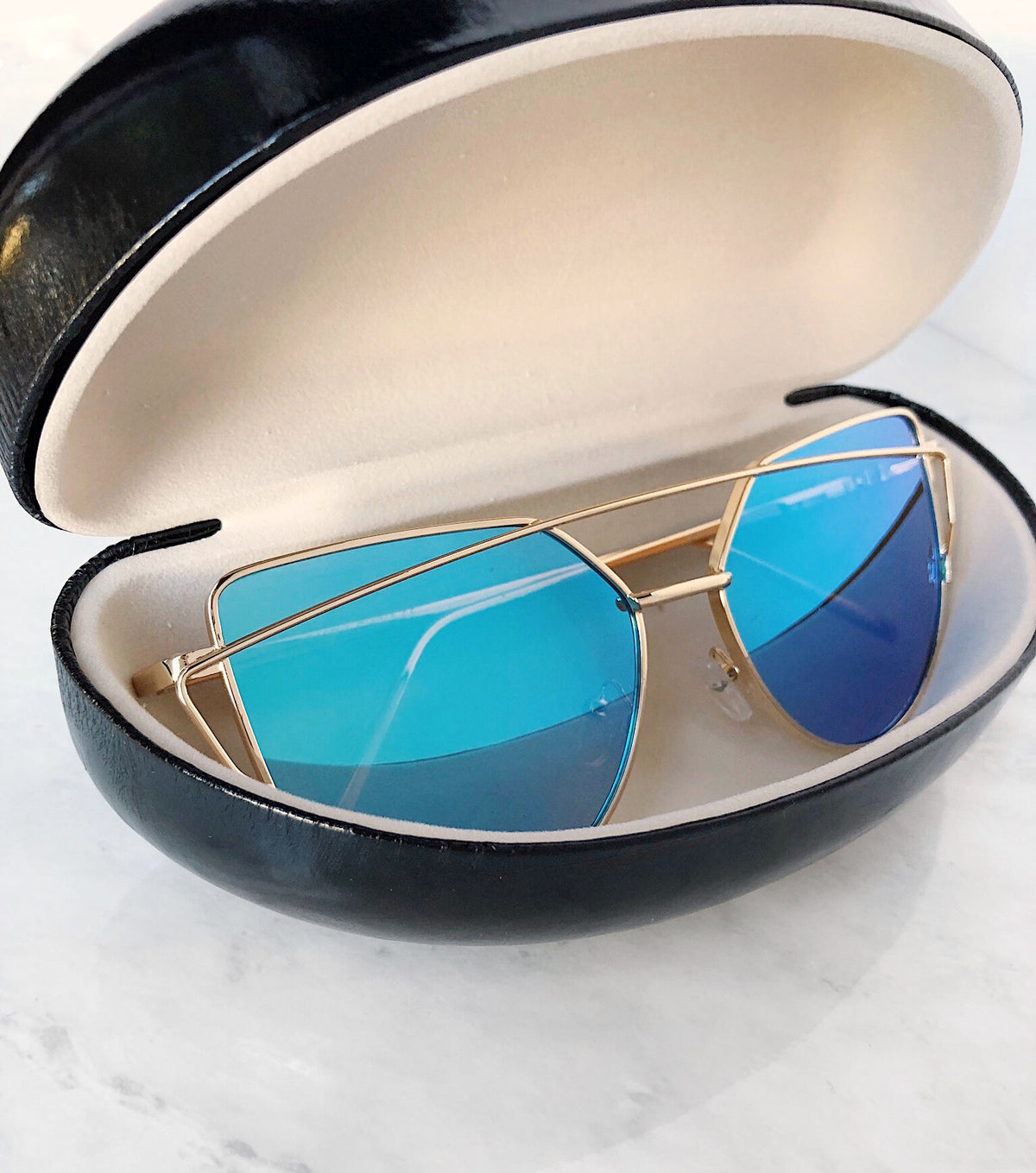 Cat eye sunglasses in a hard case