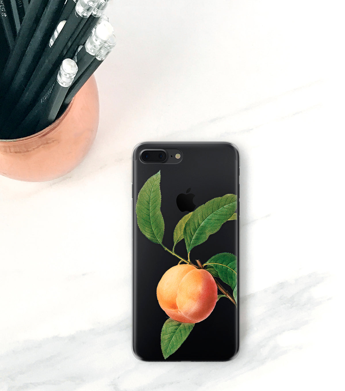 Peach clear case on black iPhone