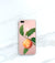 Peach clear case on black iPhone