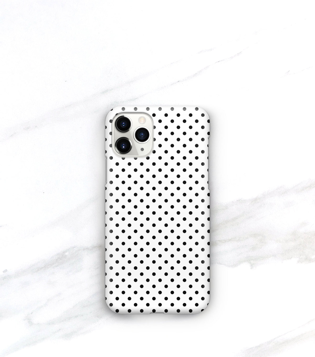 black dots on a white iphone 11 pro case in a matte finish