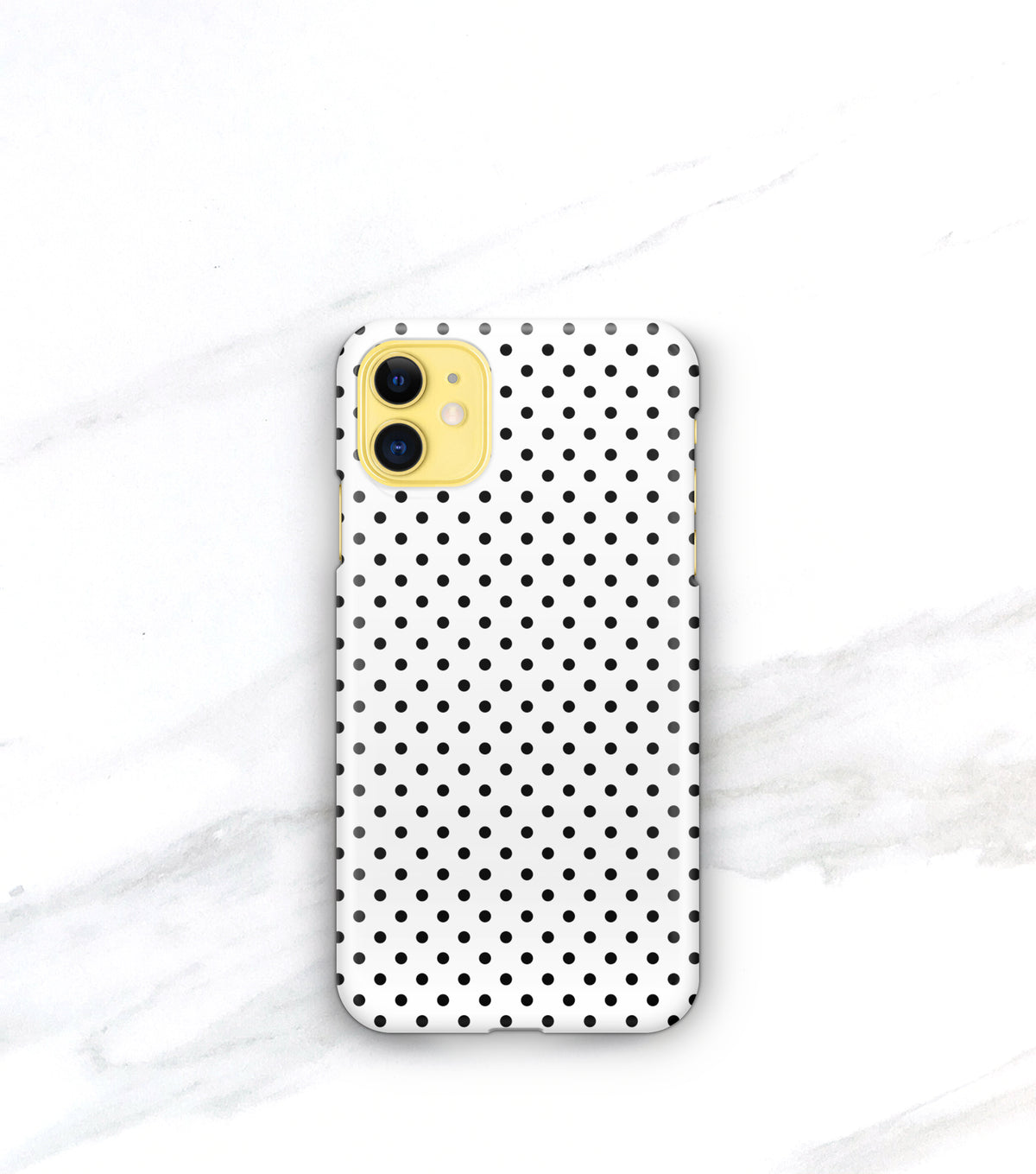 small black polkadot pattern on a case for yellow iphone 11